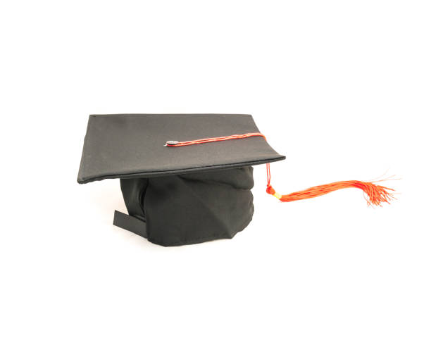 istock Studio shot of black graduation cap isolated on white background 943062816
