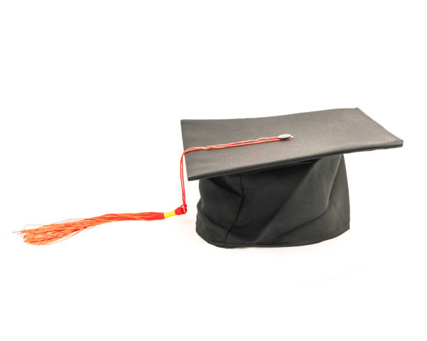 istock Studio shot of black graduation cap isolated on white background 943062898