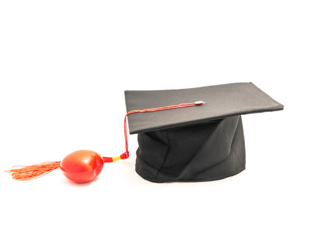 istock Studio shot of black graduation cap isolated on white background 943063064