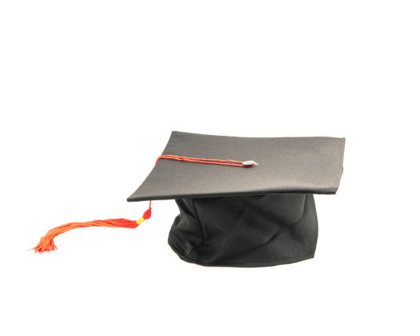 istock Studio shot of black graduation cap isolated on white background 943063142