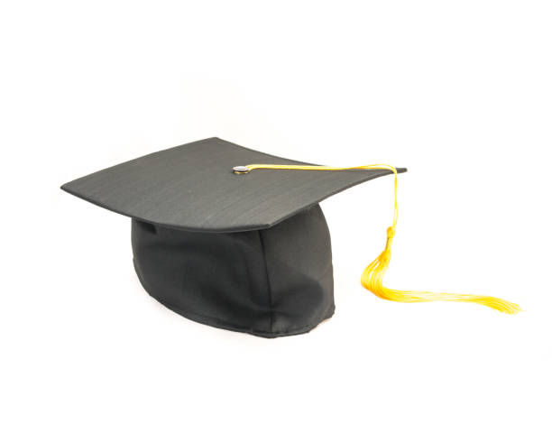 istock Studio shot of black graduation cap isolated on white background 943063216