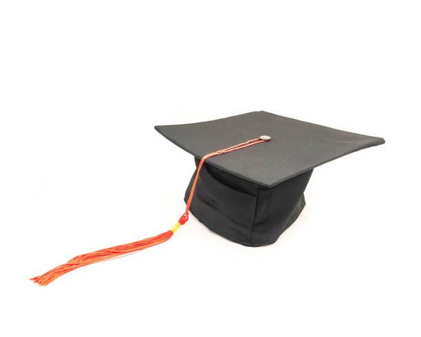 istock Studio shot of black graduation cap isolated on white background 943064910