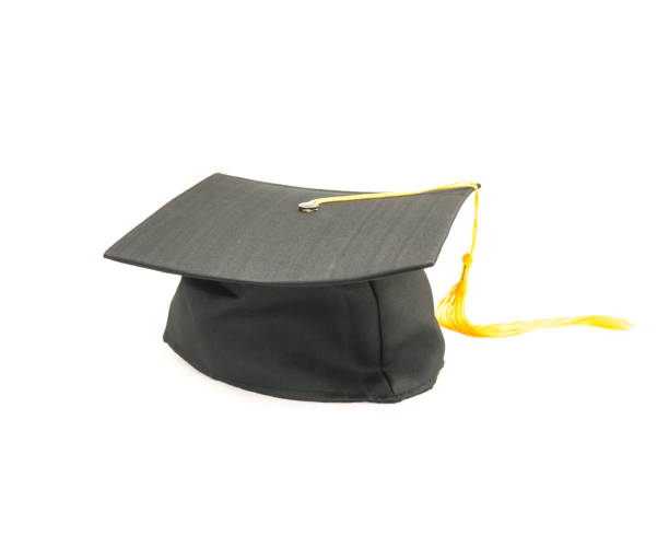 istock Studio shot of black graduation cap isolated on white background 943065348