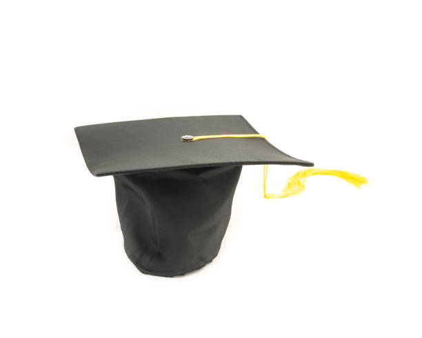 istock Studio shot of black graduation cap isolated on white background 943067510