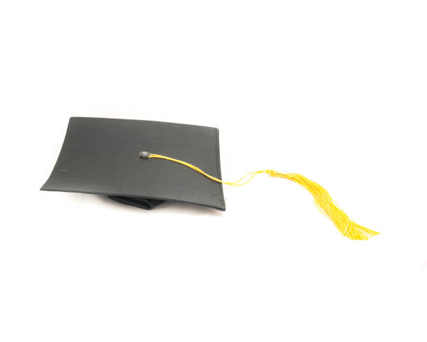 istock Studio shot of black graduation cap isolated on white background 943067540
