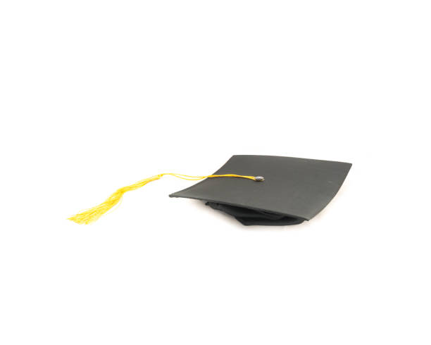 istock Studio shot of black graduation cap isolated on white background 943068448