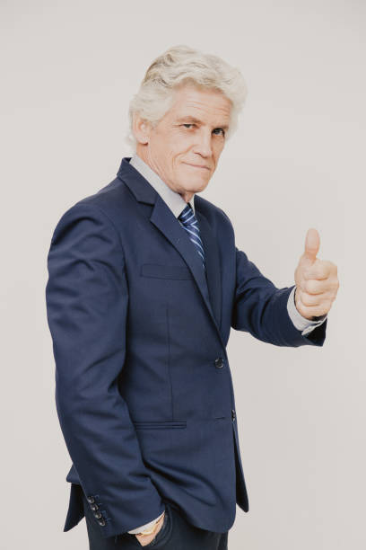 istock Confident senior businessman showing thumb up 943069632