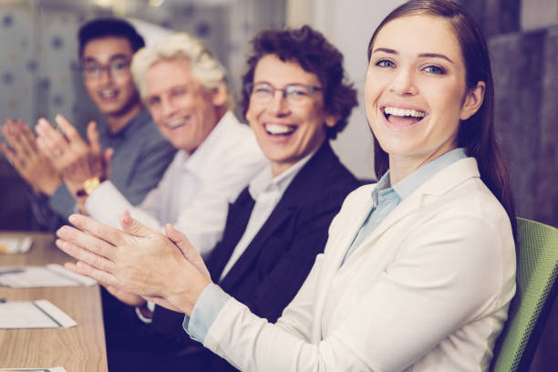 istock Cheerful business people clapping in boardroom 943069644