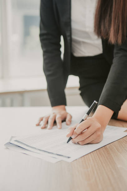 istock Cropped View of Woman Working with Document 943069826