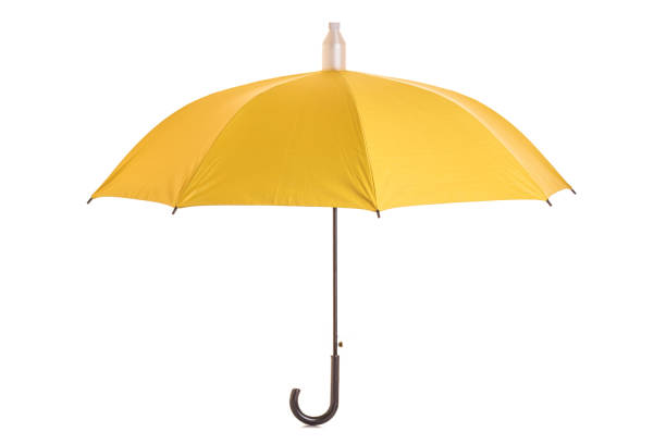istock Yellow umbrella isolated on white 943070290