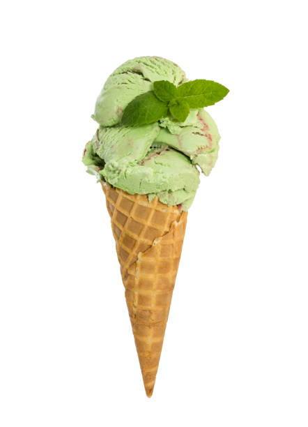 istock Mint raspberry ice cream with fresh mint in waffle cone isolated on white 943080240