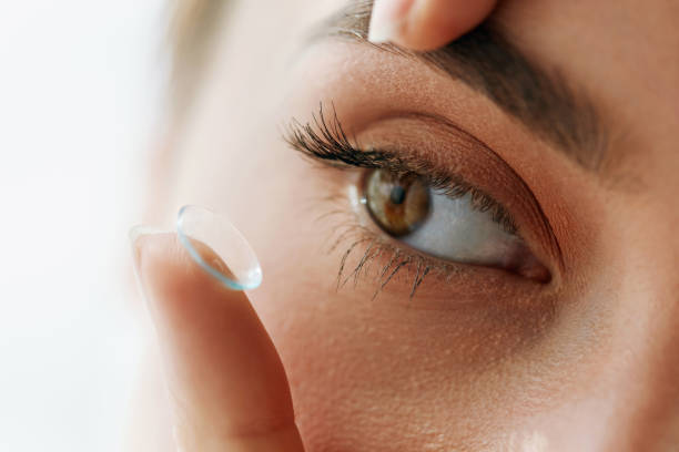 istock Vision Contact Lenses. Closeup With Beautiful Woman Face 943081764