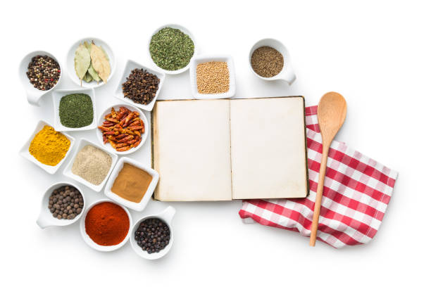 istock Blank cookbook and various spices and herbs. 943085666