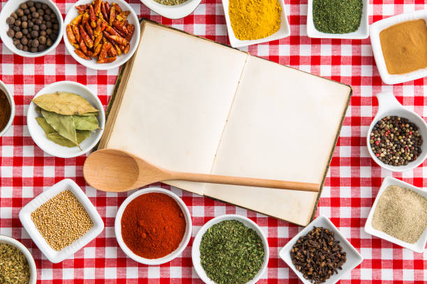 istock Blank cookbook and various spices and herbs. 943085868