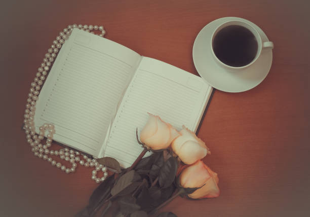 istock Diary, pink roses and cup of coffee 943098570