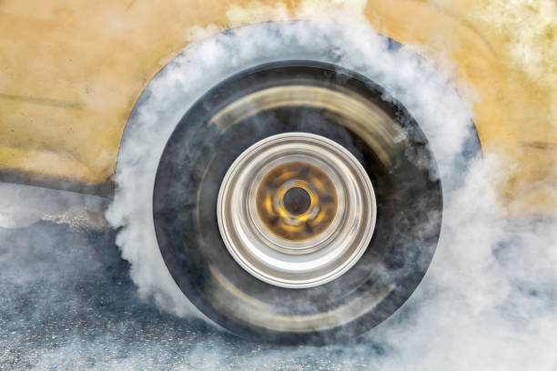 istock Drag racing car burn tire at start line 943100782