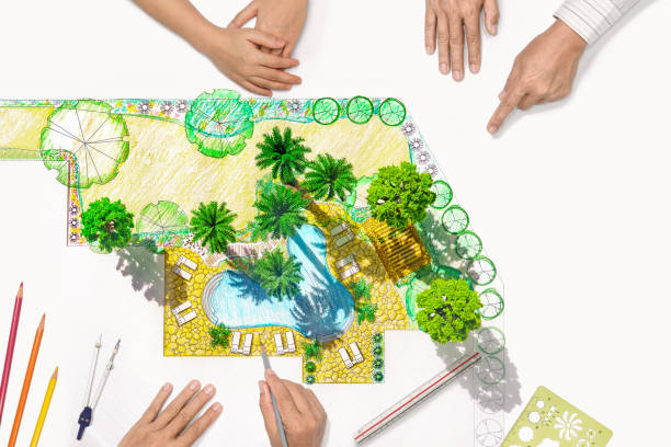 istock Landscape architect changing drawing at meeting with client 943103962