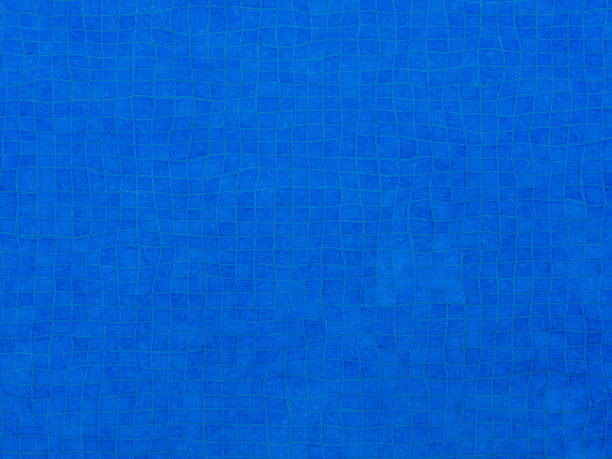 istock Blue Ripple Water in swimming pool background 943105408