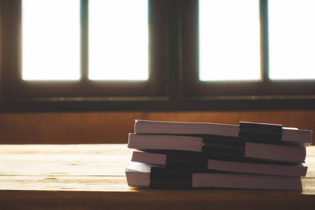 istock Stack of business report paper file on wooden table. 943109762