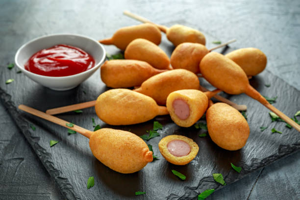istock Mini Corn Dogs on stone platter with ketchup 943109966