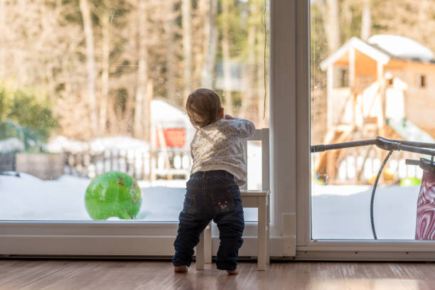istock Cute little toddler balancing on a chair 943111144