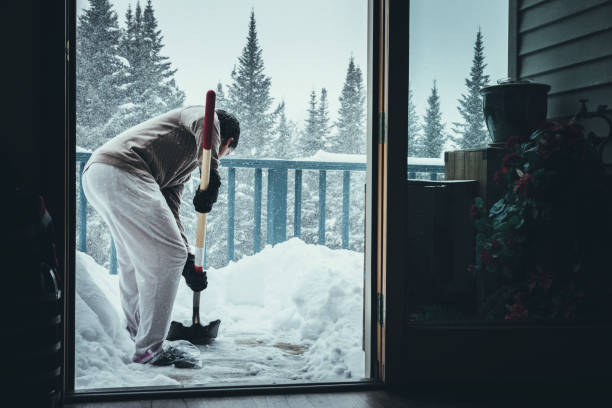 istock Shoveling out the snow from the deck 943113478