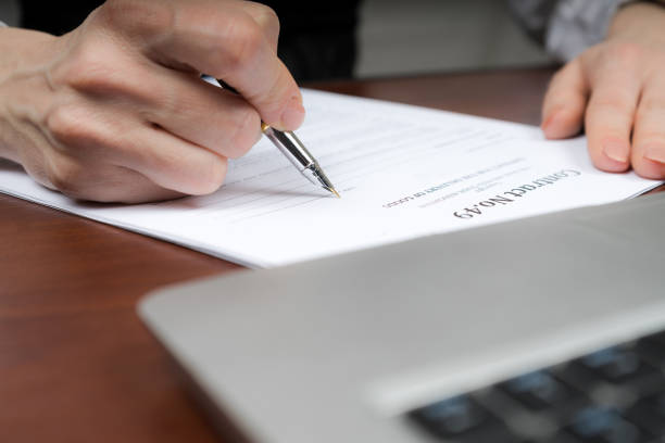 istock A businessman puts his signature on the contract. Copy space. 943126370