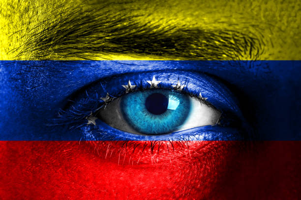 istock Human face painted with flag of Venezuela 943132380