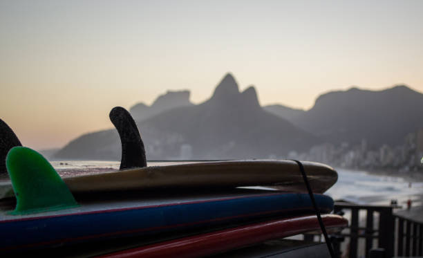istock Sunset with surfboards and two brothers hill 943133286