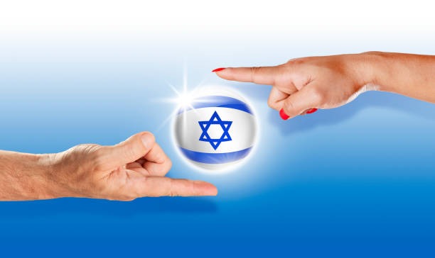 istock Israel button israeli flag floating between with human hands 943148660