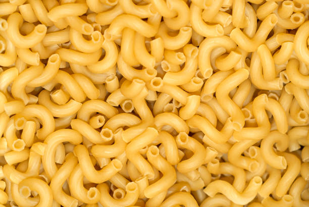 istock background - light yellow dry pasta by weight 943151550