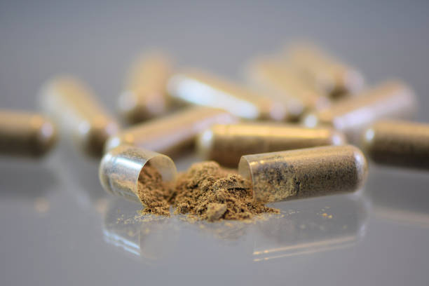 istock Herbal Medicine Pill Capsules Opened Nutritional Supplement 943152090