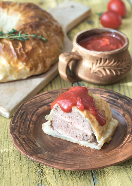 istock Portion of beef Wellington with tomato sauce 943155942