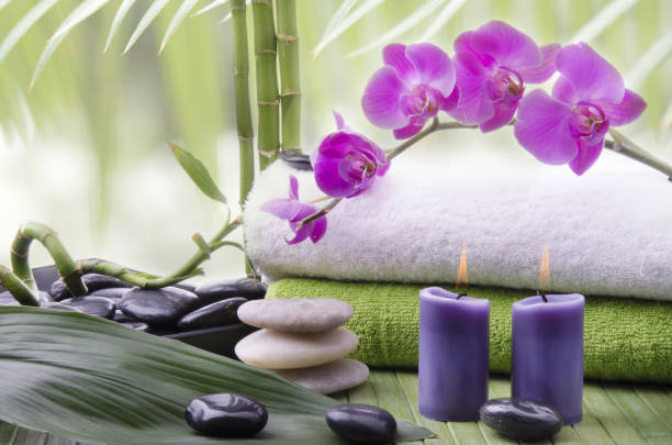 istock wellness environment with black stones and orchid flowers 943159292