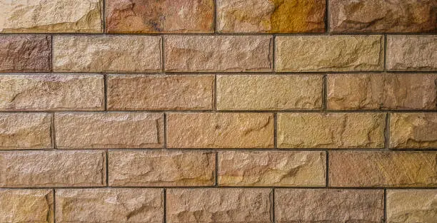 Brown and orange brick wall art concrete or stone texture background