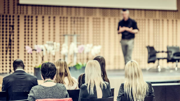 istock Audience listening to lecturer on stage 943162704