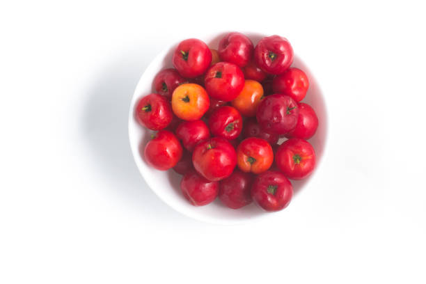Brazilian Acerola Fruit in a bowl isolated on white background