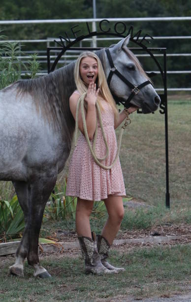 istock Fancy Cowgirl at the Welcome Sign 943170334