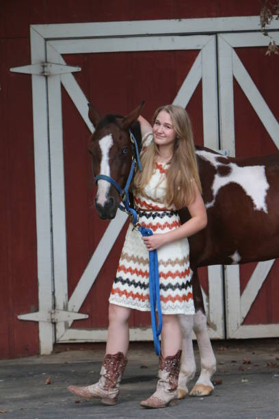istock Fancy Cowgirl in Front of the Tool Shed 943170526