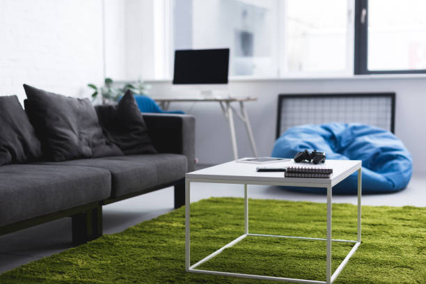 istock computer, sofa and tables in living room 943184590