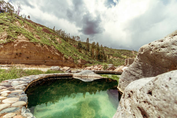 Pool of hot springs next to the rapids and mountains in the Colca Valley, Peru stock photo