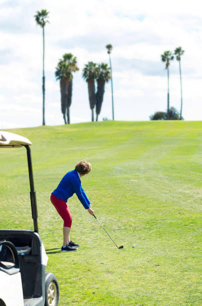 istock Women Golfer Ready to Drive Ball 943204000