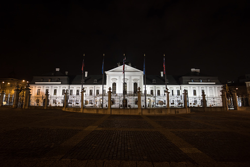 Wide angle footage of the Presidential Palace in Bratislava at night.