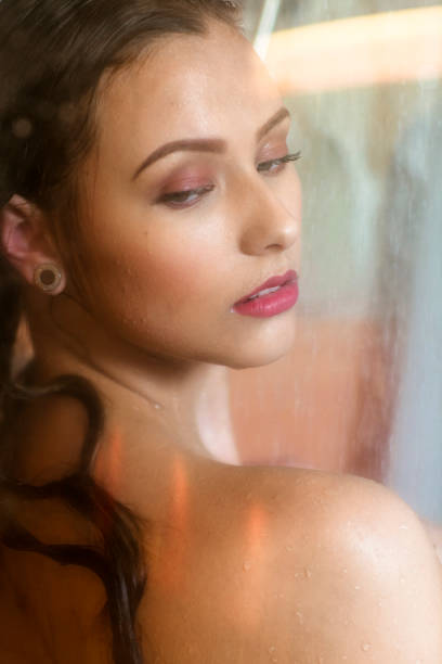 istock Young Beautiful Woman Taking Shower 943207228