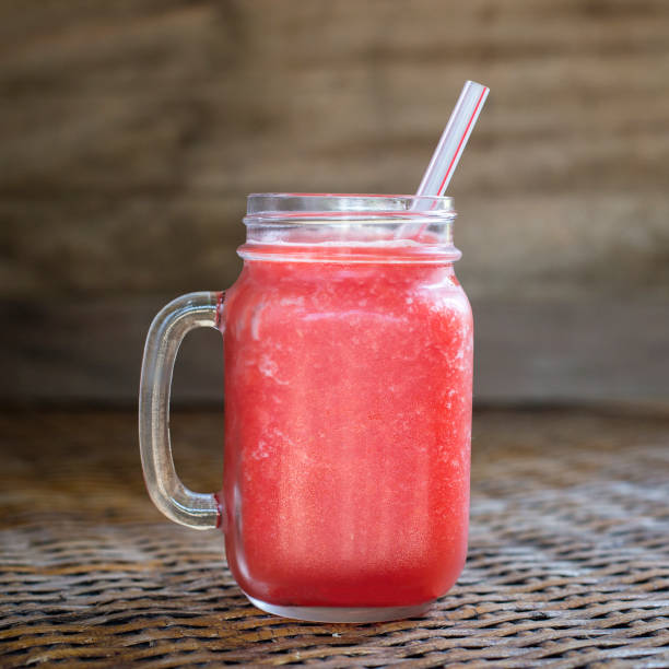 istock Fresh organic watermelon smoothie in glass mug , close up 943207698
