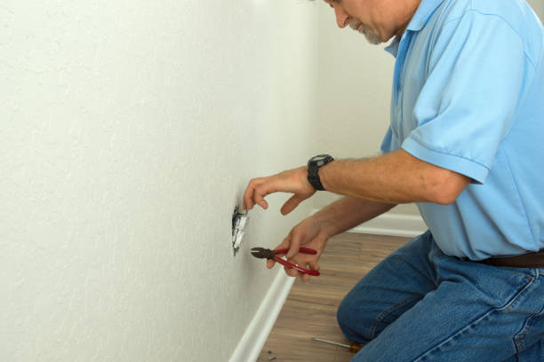 istock Professional electrician or experienced home owner fixing broken electric socket 943207770