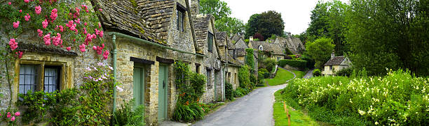 Country cottages panorama  thatched roof stock pictures, royalty-free photos & images