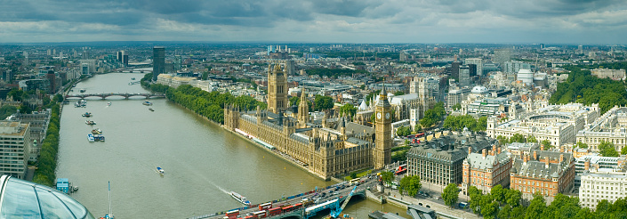 Central London,England,United Kingdom-August 21 2019:On a summer day,Union Jack flags fly over the sunny,quintessential streets of the vibrant English capital.