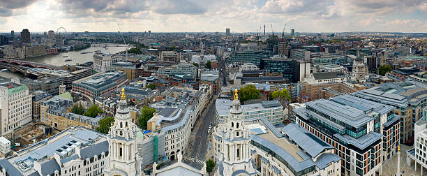 City streets, London View from the top of St. Paul's Cathedral, London, UK. Numerous landmarks visible, including the River Thames, the BT Tower, the golden justice statue on top of the Old Bailey, Paternoster Square and Whitehall. Adobe RGB 1998 color profile. paternoster square stock pictures, royalty-free photos & images