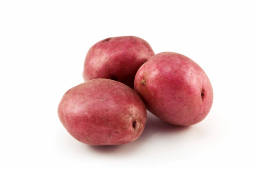 Whole raw Red Pontiac potatoes isolated on white background